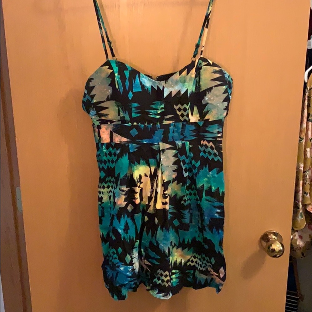 Thin strapped above the knee dress w small cutouts